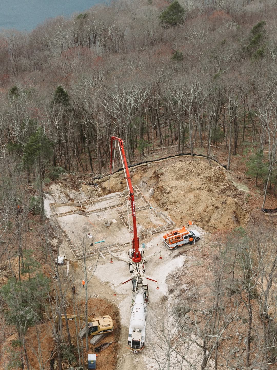 Concrete pump truck on hillside foundation pour